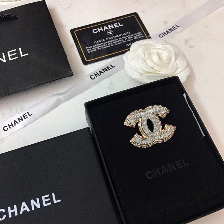 Ch**el brooches